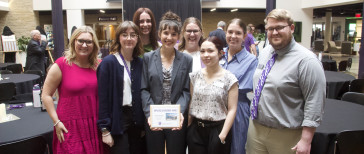 2025 Student Staff Member of the Year Jordan Fairchild (front center) is seen here with members of UPC staff. 