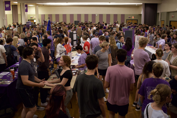 Students gathered in Union Ballroom, browsing marketing tables.